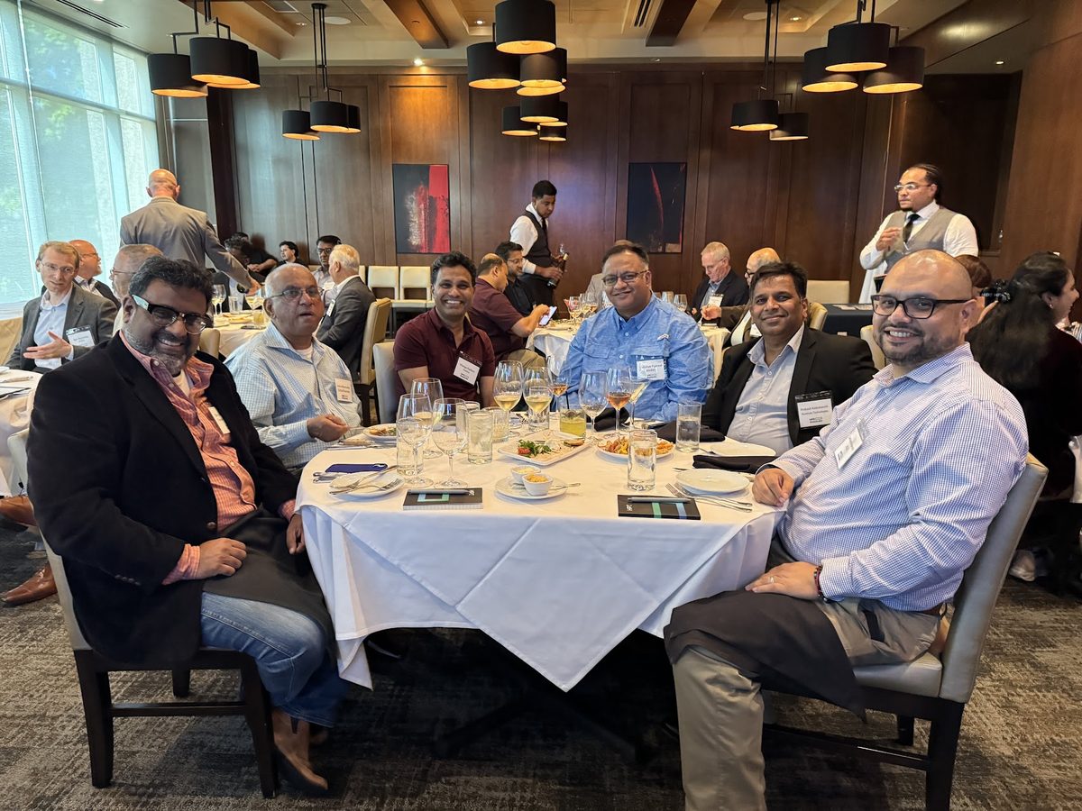 Attendees seated together at an HPE executive dinner