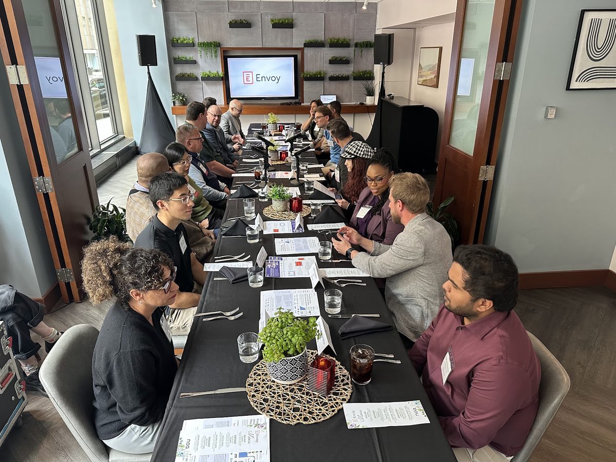 A long-table roundtable discussion at an Envoy executive lunch