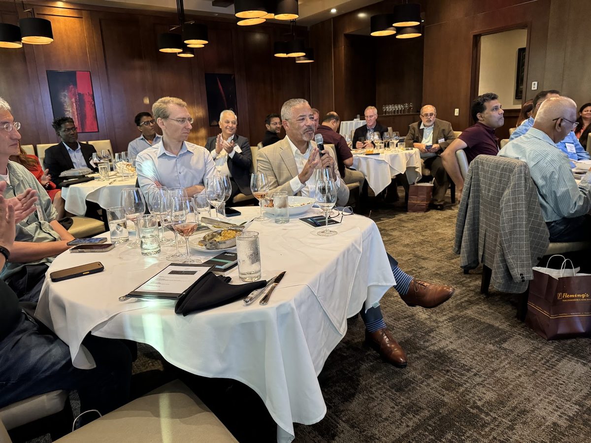 Attendees listening during an HPE panel discussion