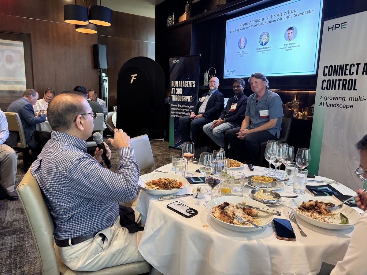 A speaker addressing the room at an HPE GreenLake event