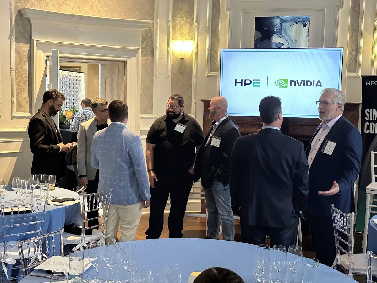 Executives in conversation at an HPE and NVIDIA dinner