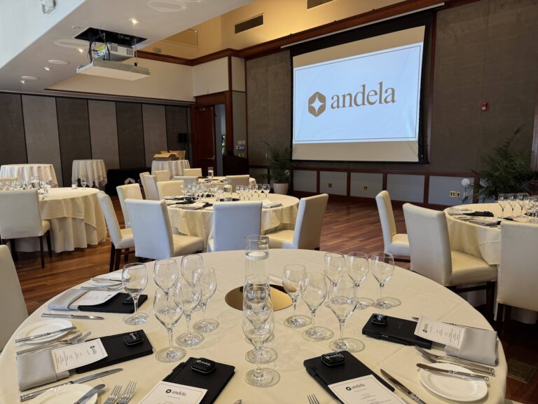 The dining room set for the executive dinner, with Andela branding on screen