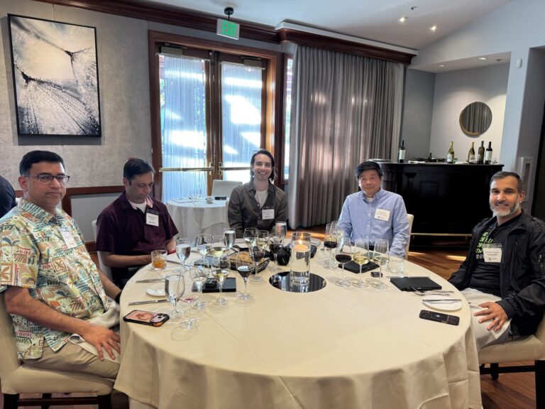 Attendees around a table during dinner