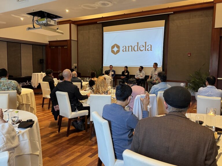 The room seen from behind the seated attendees