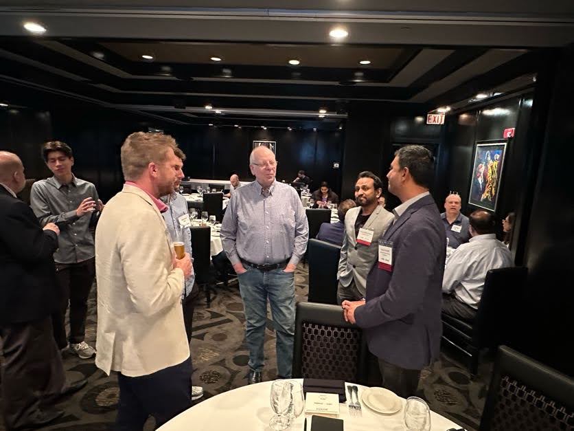 Attendees connecting in a private dining setting