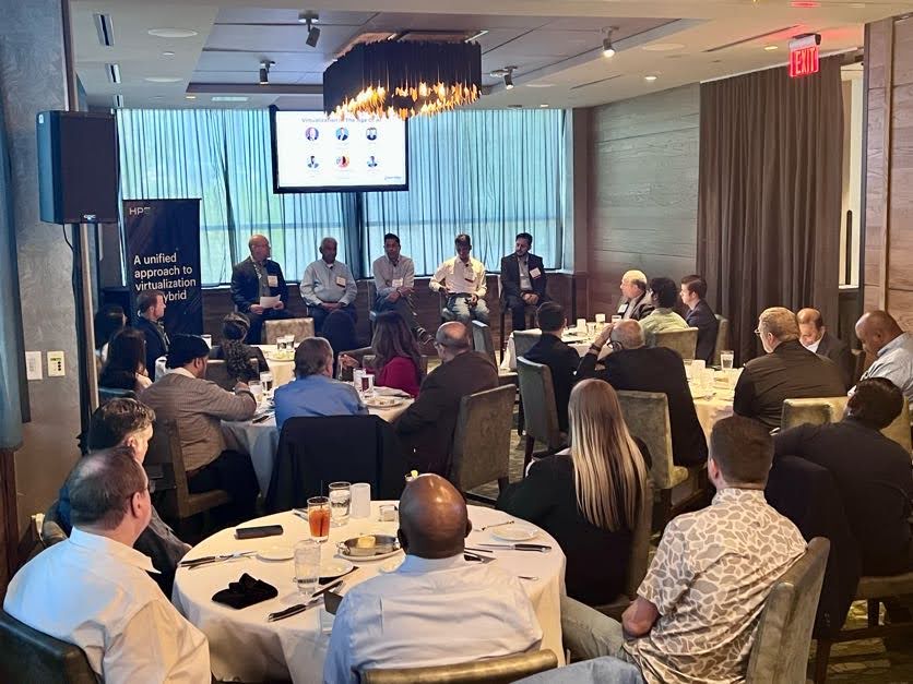 Business leaders gathered around a table for a BDI roundtable