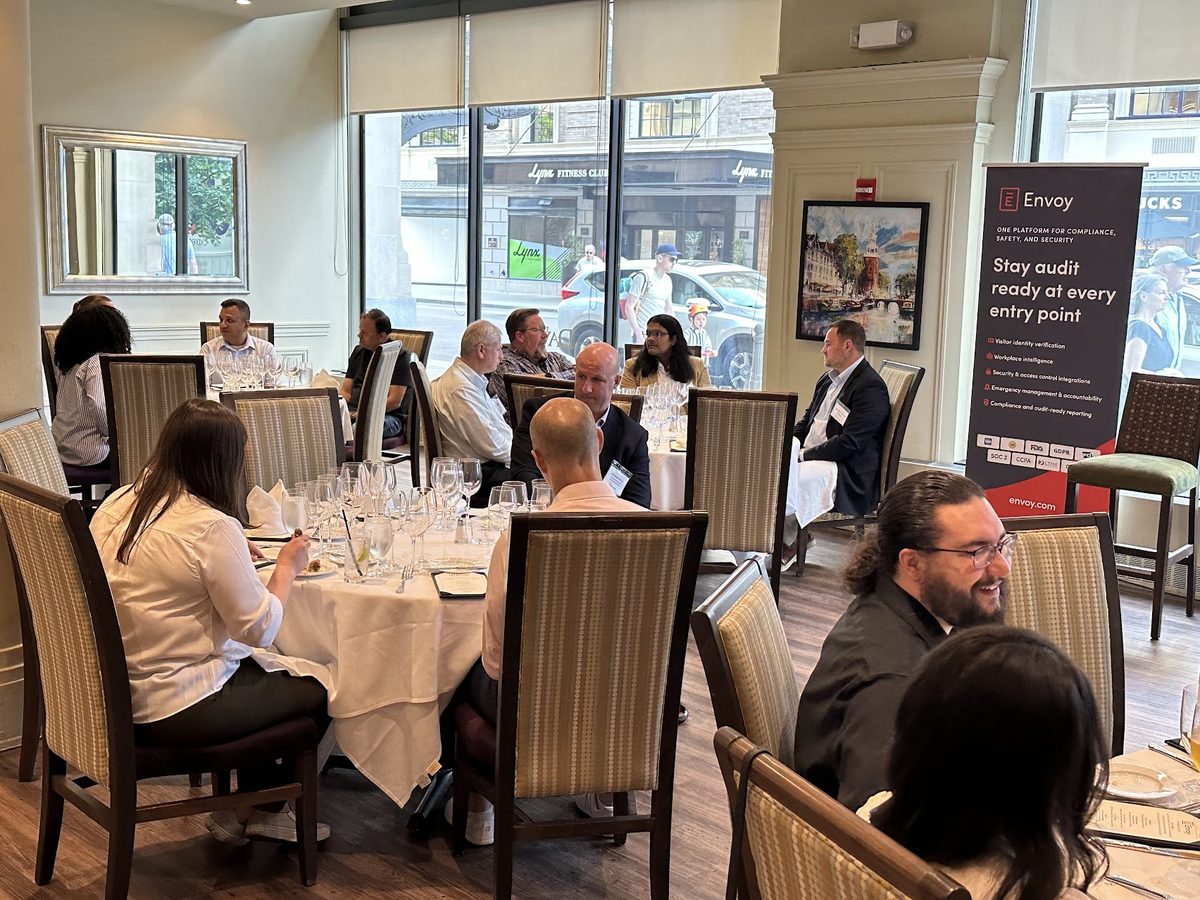 Attendees in conversation at an Envoy dinner