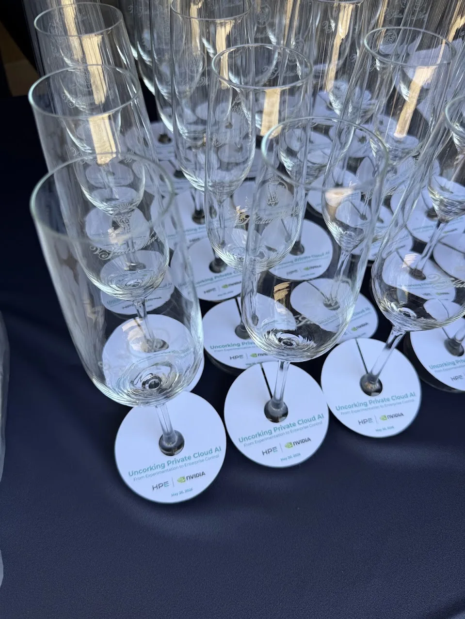 Branded glassware set out for an HPE and NVIDIA event